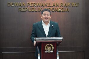 Kuasa Hukum DPR RI, Abdullah saat membacakan Keterangan DPR RI dalam Pengujian Materiil Undang-Undang Nomor 31 Tahun 1997 tentang Peradilan Militer di Sidang MK, yang disampaikan secara daring, di Gedung Setjen, DPR RI, Rabu (25/2/2026). Foto : Tari/Andri.